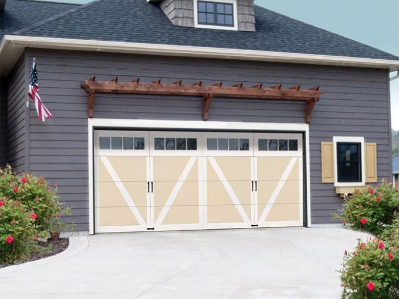 beige home exterior with white garage doors