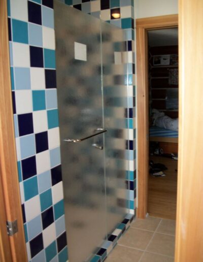 bathroom with blue and white checkered tile