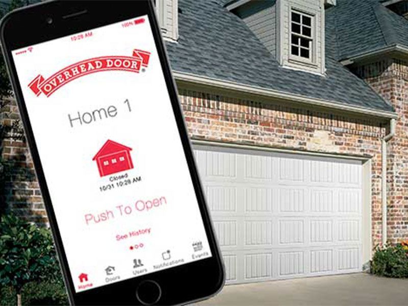 beige home exterior with white garage doors